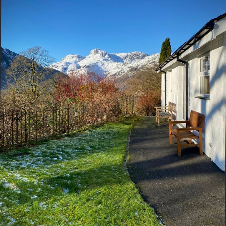 Langdale Cottage logo - text in front of Langdale Pikes silhouette